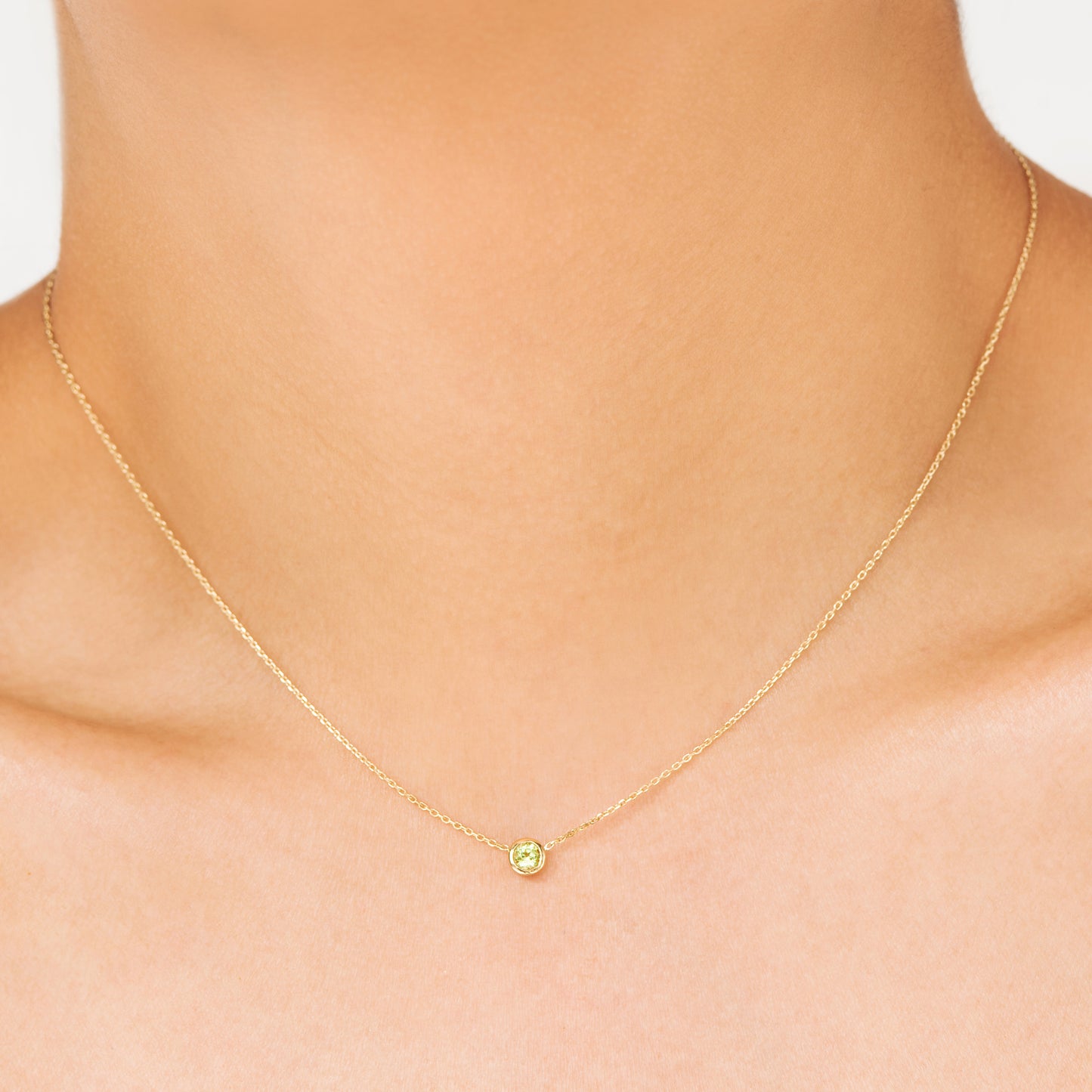 Classic 'yellow-green' variety, Peridot is the birthstone necklace celebrating August. Consisting of 18k gold chain with extenders to personalise length of necklace/choker. Perfect as an anniversary, birthday or special occasion jewellery present.