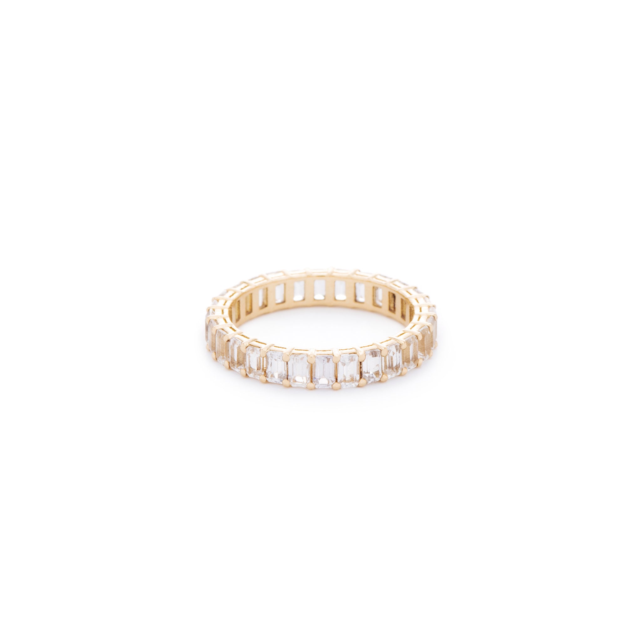 White emerald cut sapphire ring. Handcrafted in Australia from with custom cut petite size natural sapphires with 18K gold band. All stones individually assessed by certified gemologist.